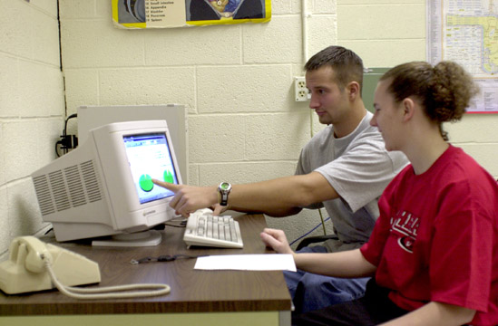 Students at a computer researching Exercise Prescription