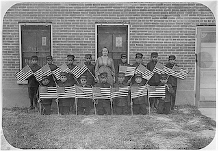 Class of young boys with flags, Albuquerque Indian School